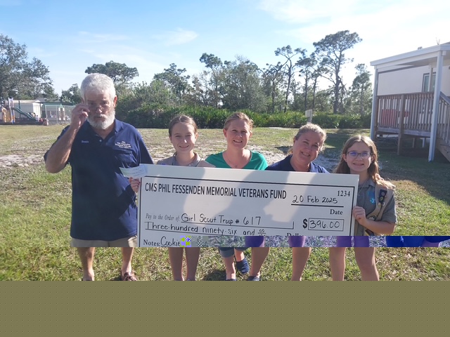 Check presented to Girl Scout Troop 617
